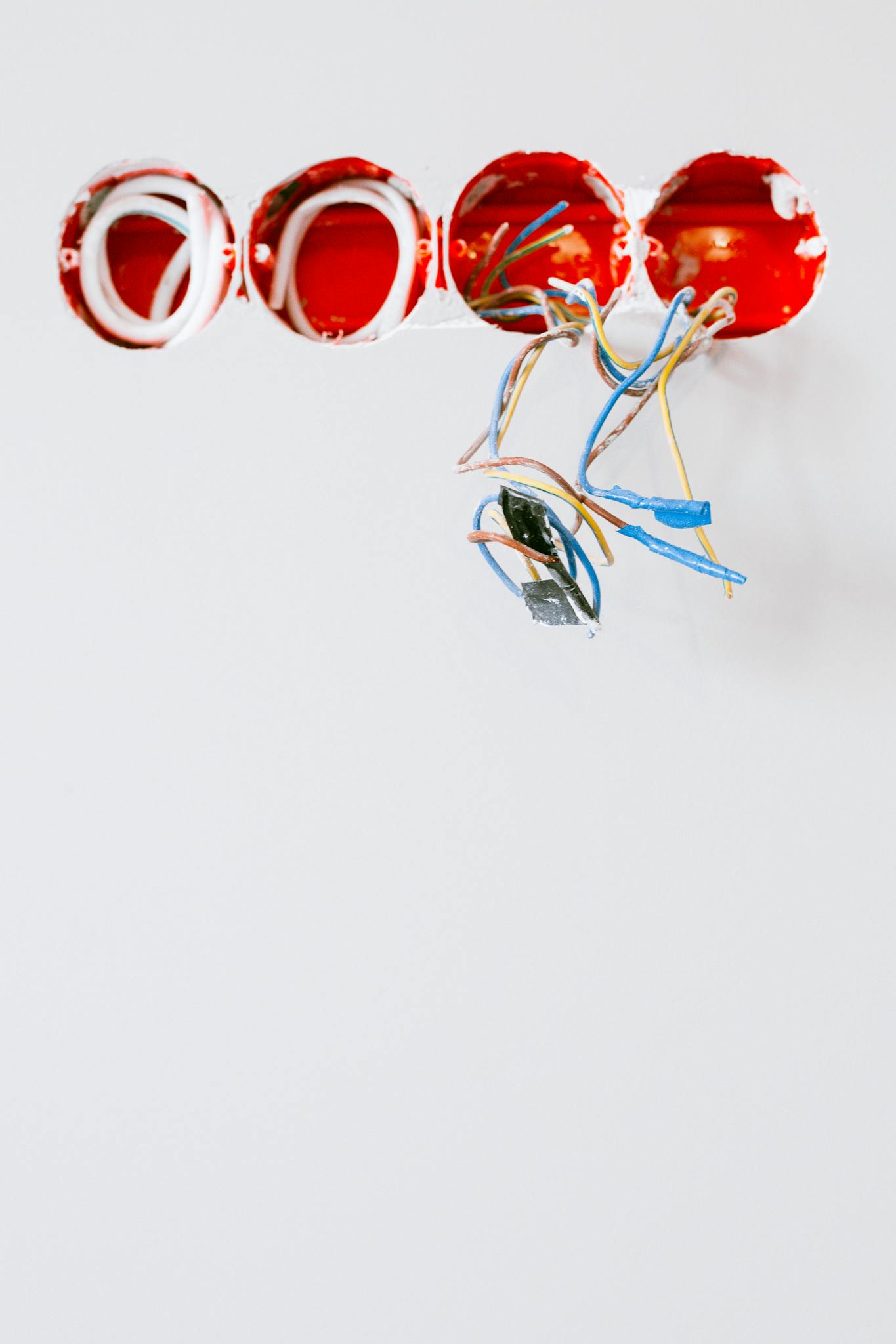 Close Up Of Exposed Electrical Wiring And Sockets